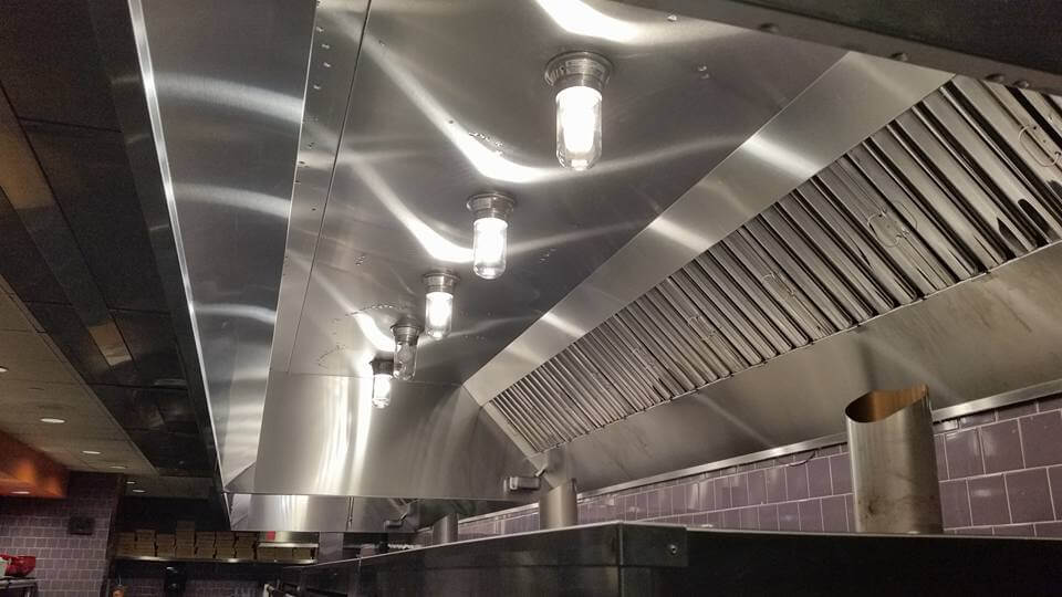 Clean commercial kitchen hood after service